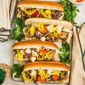 Slow Cooker Italian Beef Sandwiches on a plater with napkins