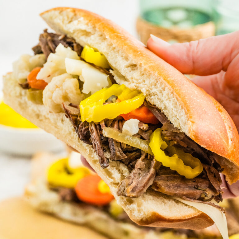 Holding a Slow Cooker Italian Beef Sandwich