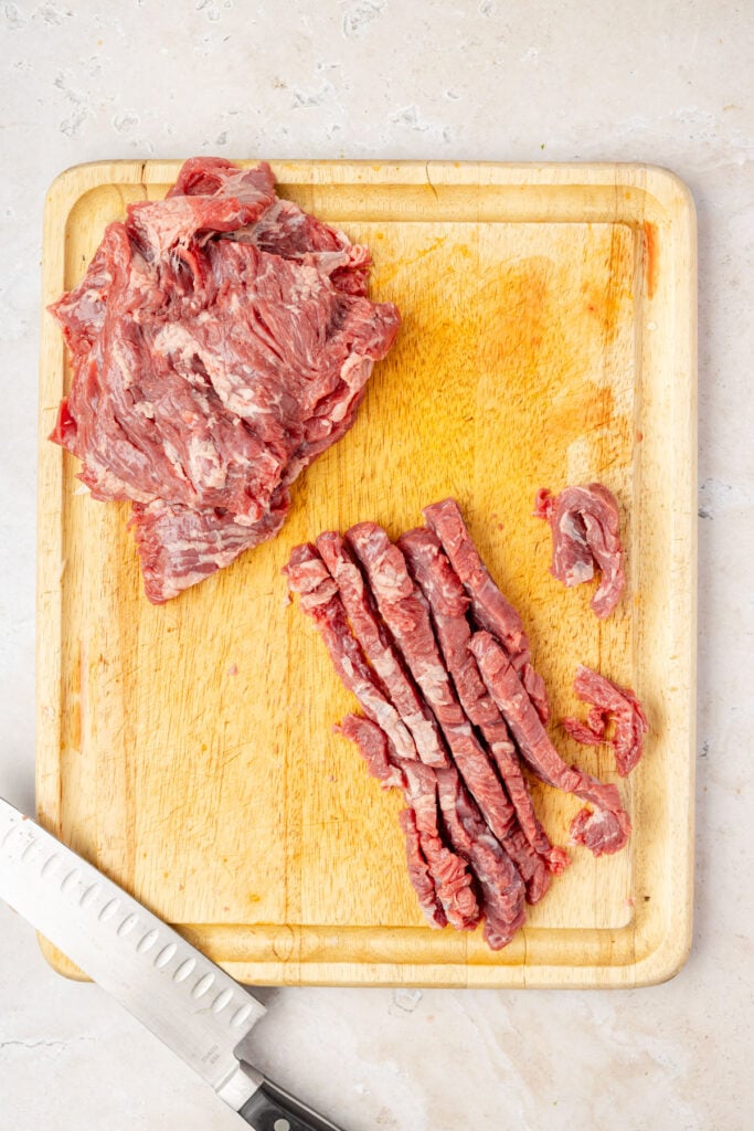 Slicing up steak for sheet pan fajitas.