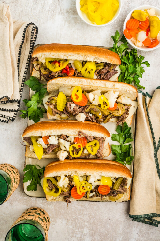 Slow Cooker Italian Beef Sandwiches on a plater with napkins