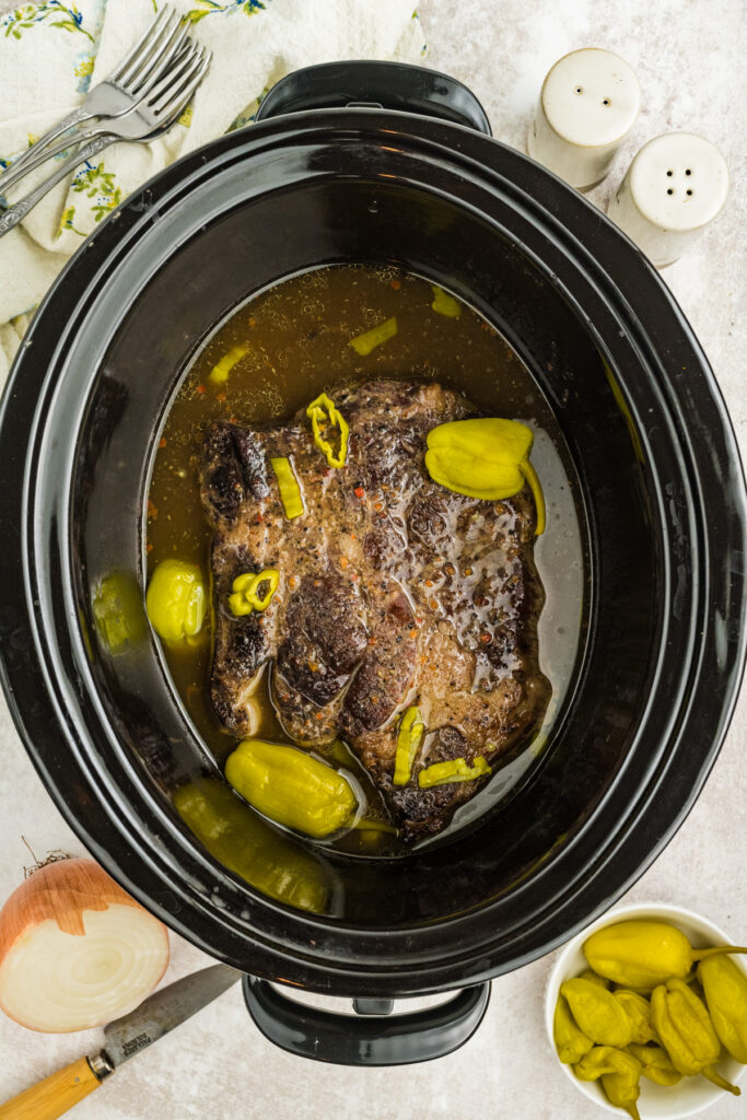 finished Slow Cooker Italian Beef in a crockpot before shreding
