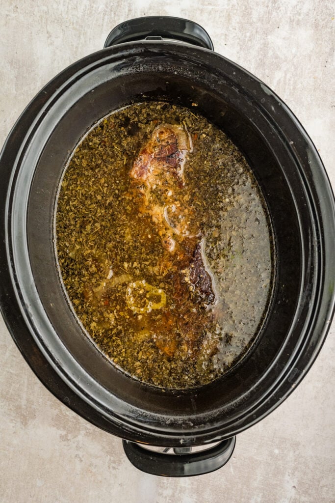 Italian beef soaked in rich savory broth in slow cooker