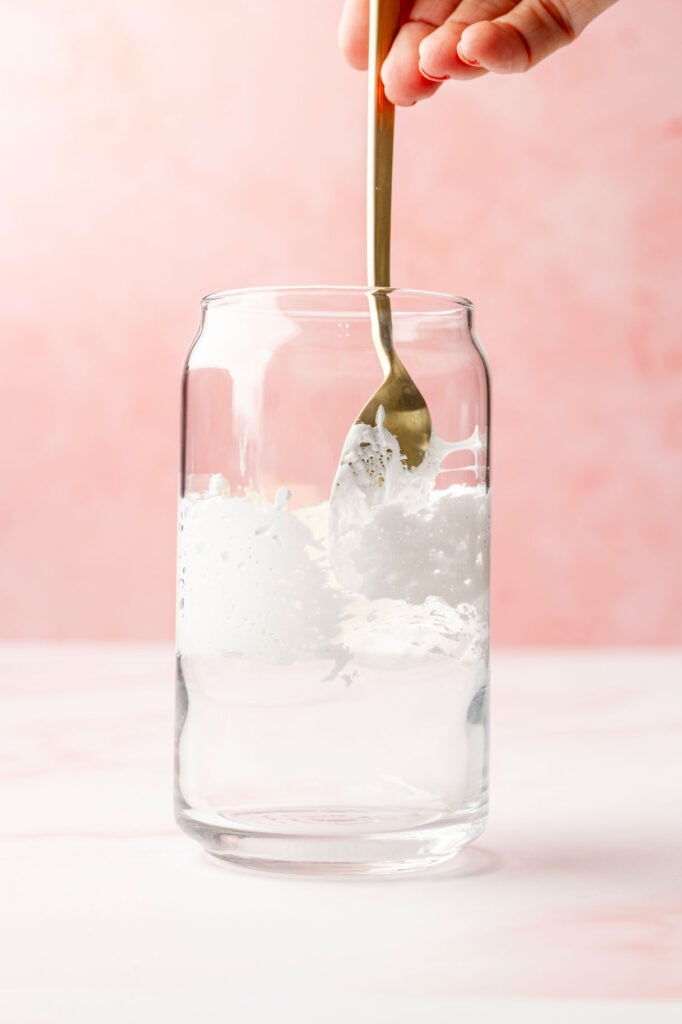 Spreading marshmallow fluff in a cup