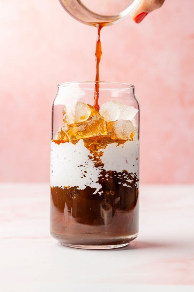 Adding espresso to a cup with marshmallow fluff
