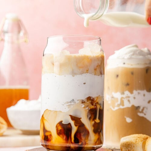 milk dripping into Toasted Marshmallow Iced Latte
