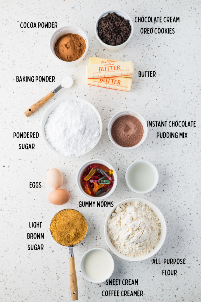 Ingredients for dirt cake cookies in small bowls and measuring cups