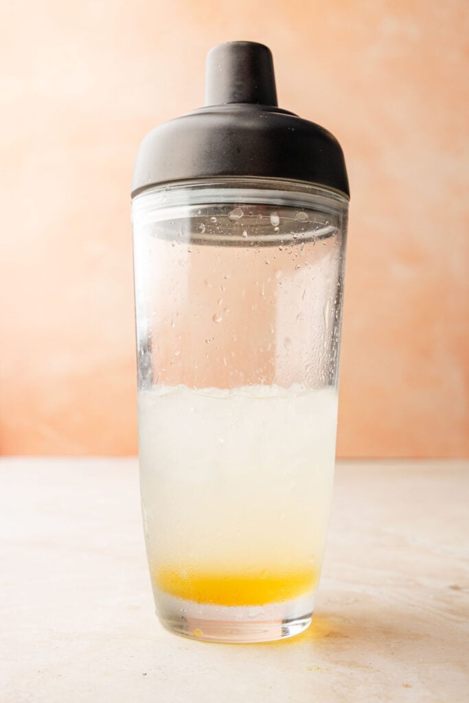 Ingredients for Mango Margarita in a cocktail shaker.