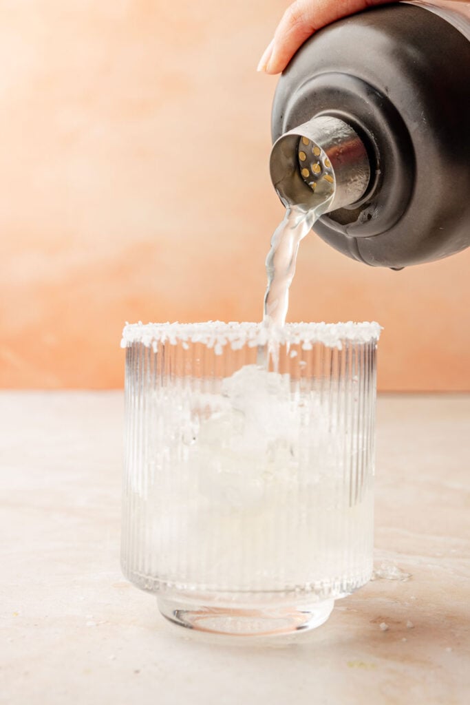 Mango Margarita pouring into a glass