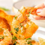 Hand picking up BBQ Shrimp