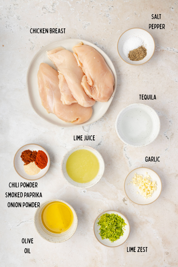Chicken, tequila, lime juice, spices, and garlic in individual bowls.