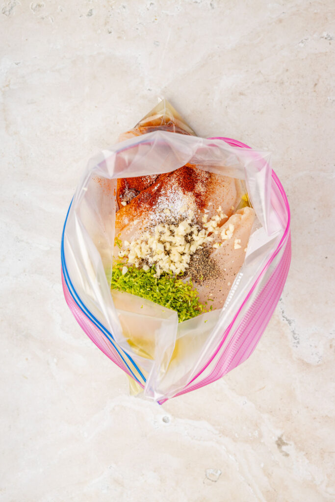 Chicken, tequila, lime juice, spices, and garlic in a Ziploc bag