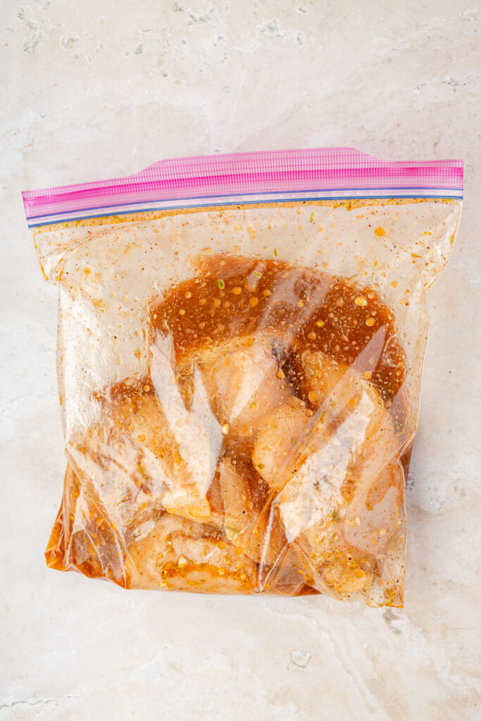 Chicken breast marinating in a tequila lime marinate.