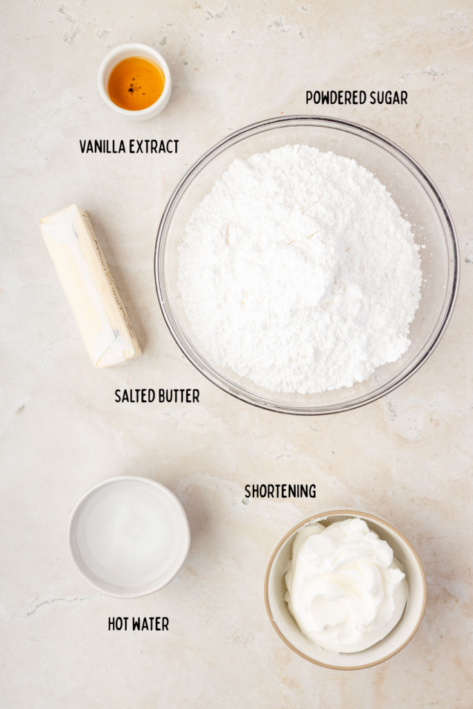 Powdered sugar, vanilla extract, butter, shorten, water in little individual mixing bowls