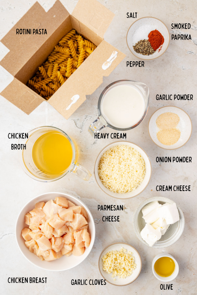 Ingredients for Creamy Chicken and Garlic Pasta in small bowls