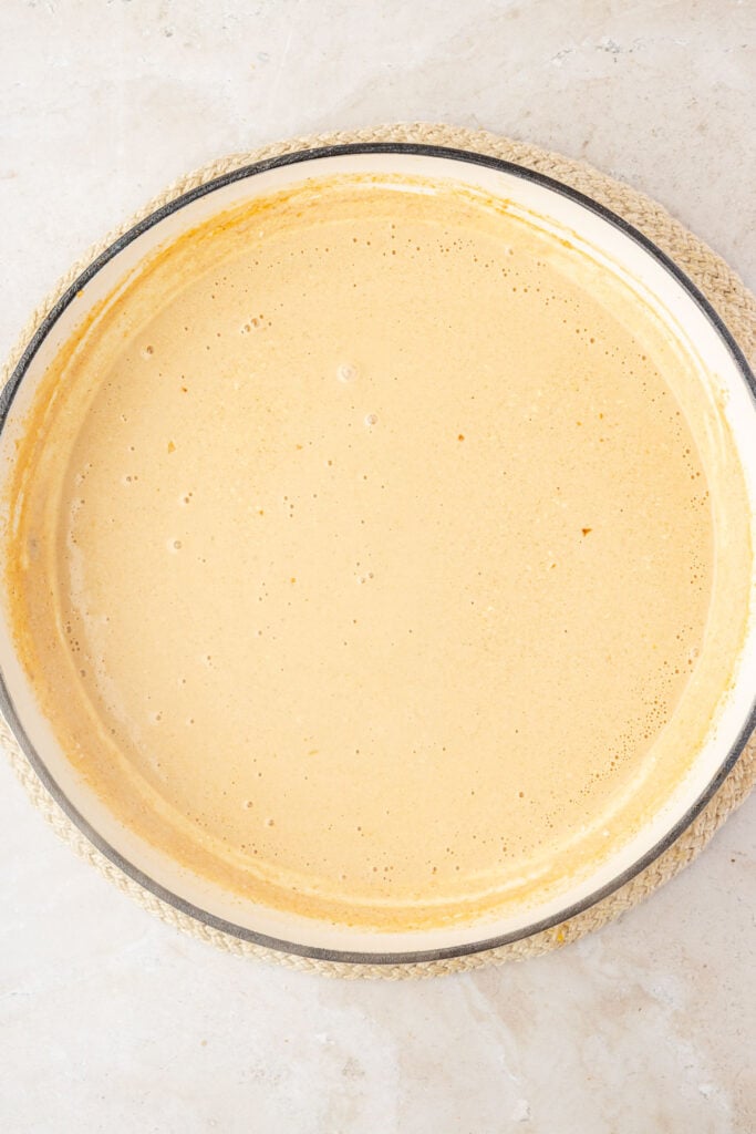 Finish creamy garlic pasta sauce in a pan.