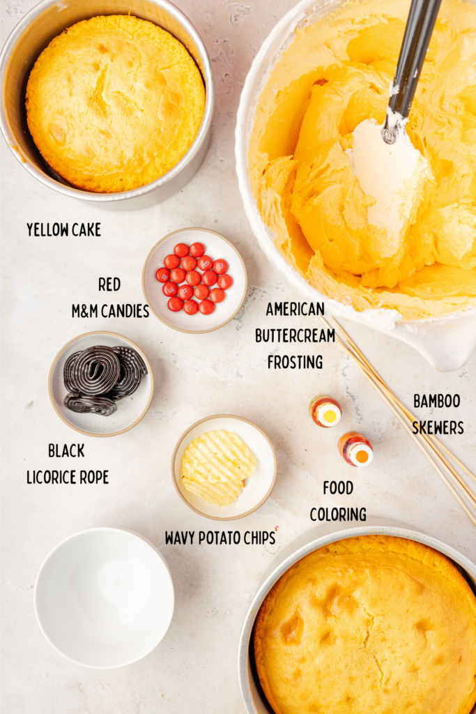 ingredients for frosting a duck cake in small bowls.