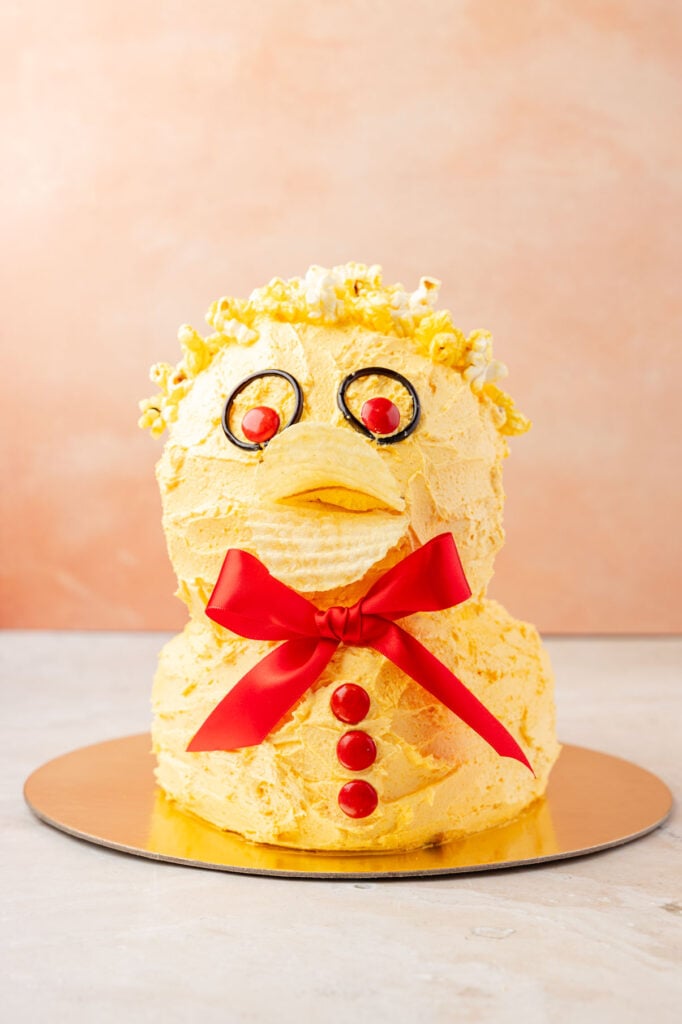 Finished duck cake on a gold board.
