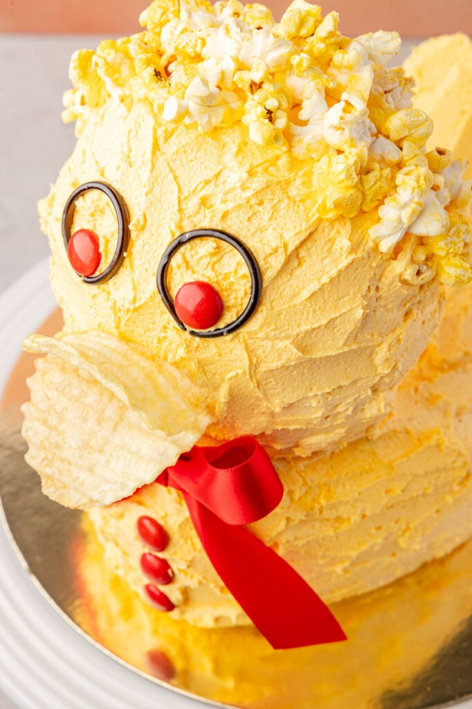 Finished duck cake on a gold board.