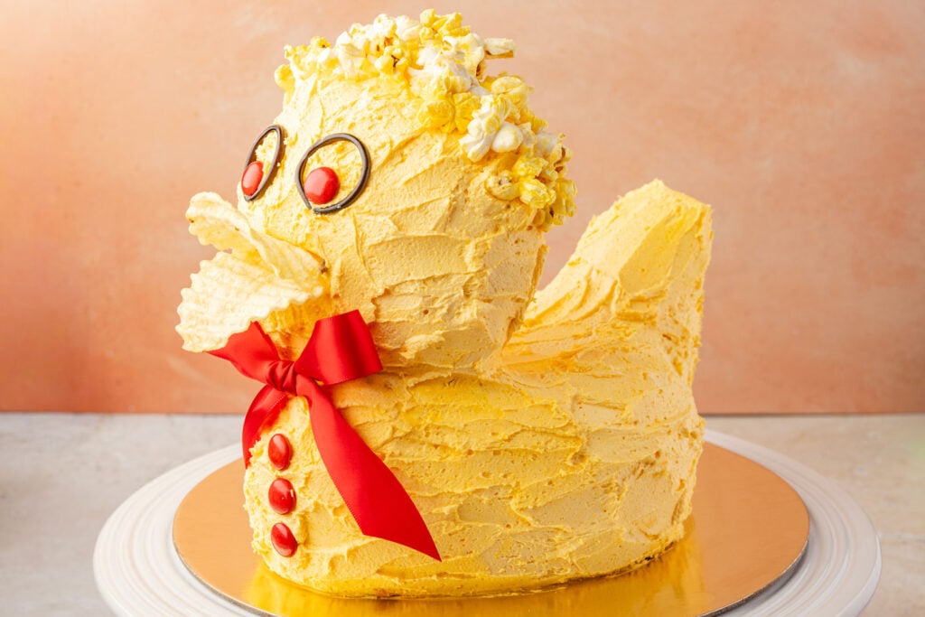 Finished duck cake on a gold board.
