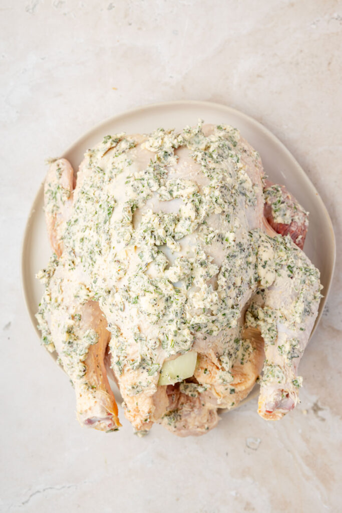 garlic and herb butter coated chicken on a plate