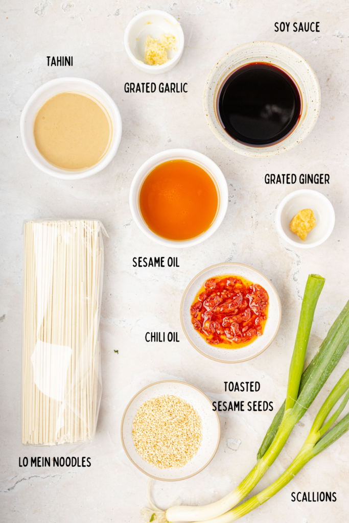 Sesame Noodles ingredients on a board in individual small bowls.