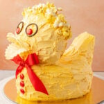 Finished duck cake on a gold board.