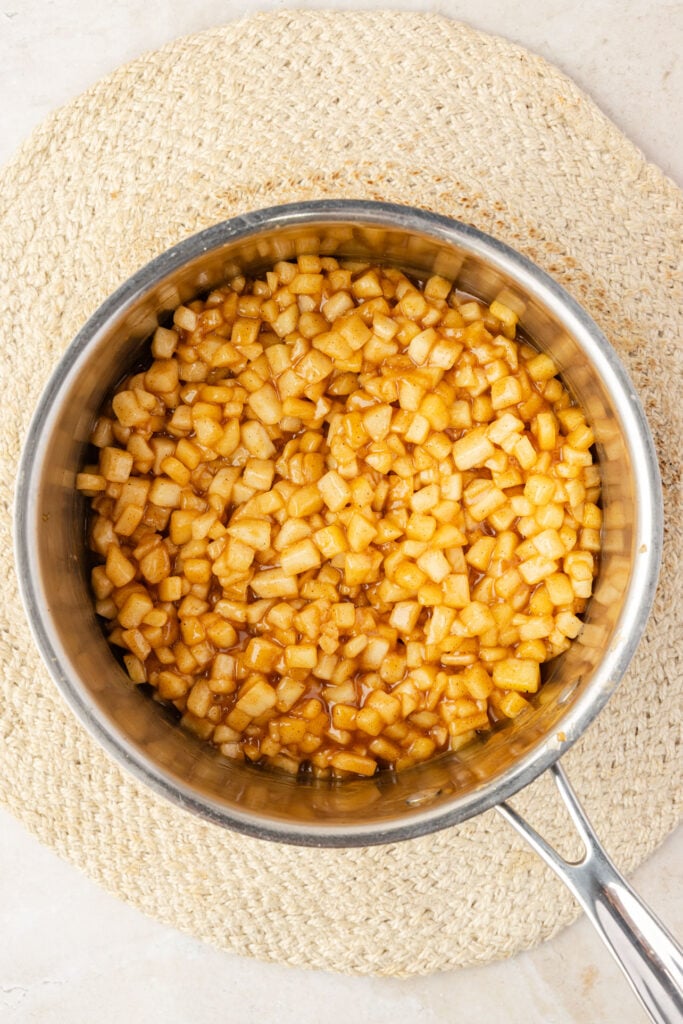 Cooked apple pie filling in a pan