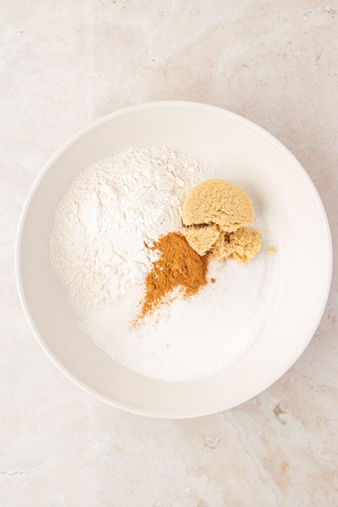 Flour, sugar, spices, brown sugar in a mixing bowl