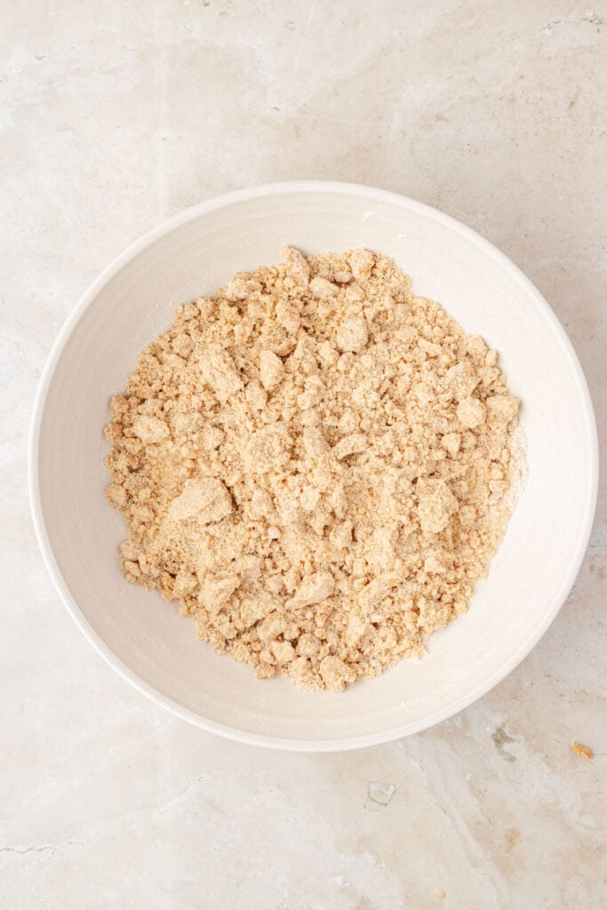 Finished crumble topping in a mixing bowl