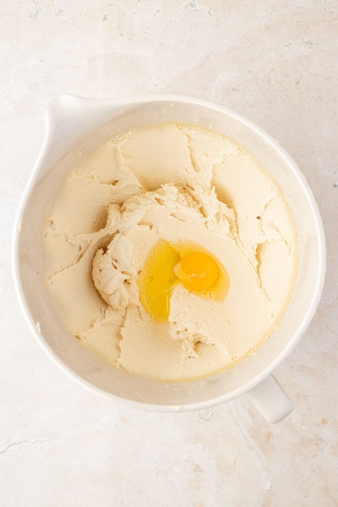 Creamed butter and sugar in a mixing bowl with eggs