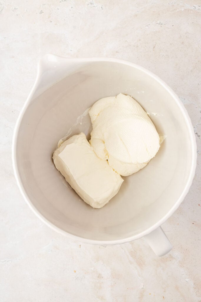 Ricotta cheese, and cream cheese in a mixing bowl