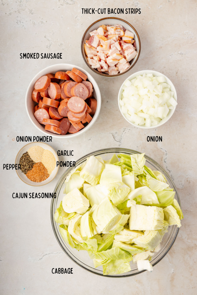 ingredients for Fried Cabbage and Sausage in small bowls
