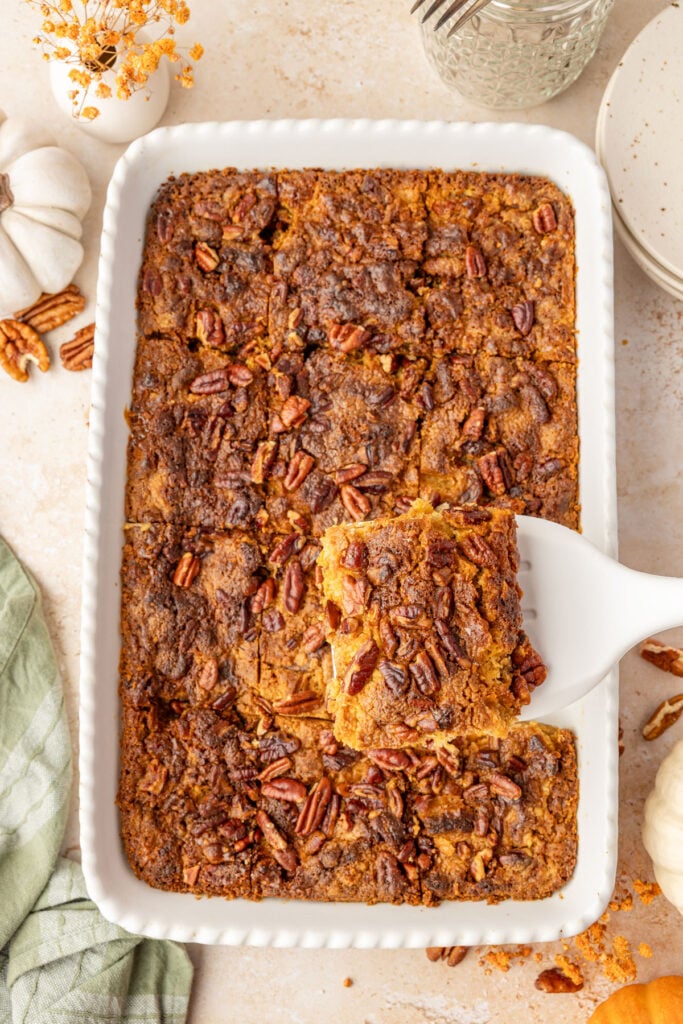 Pumpkin Crunch Cake on a spatula being removed from the cake