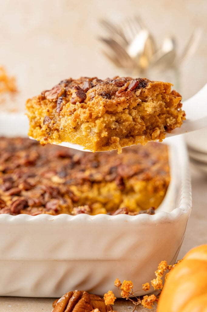 Pumpkin Crunch Cake on a spatula being removed from the cake