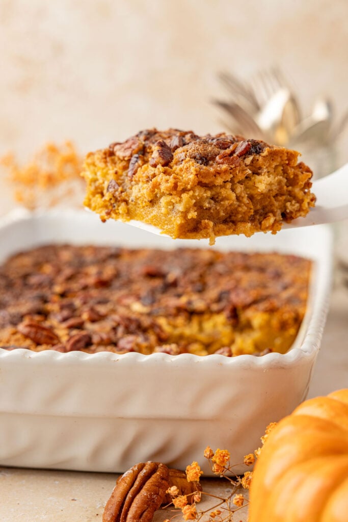 Pumpkin Crunch Cake on a spatula being removed from the cake