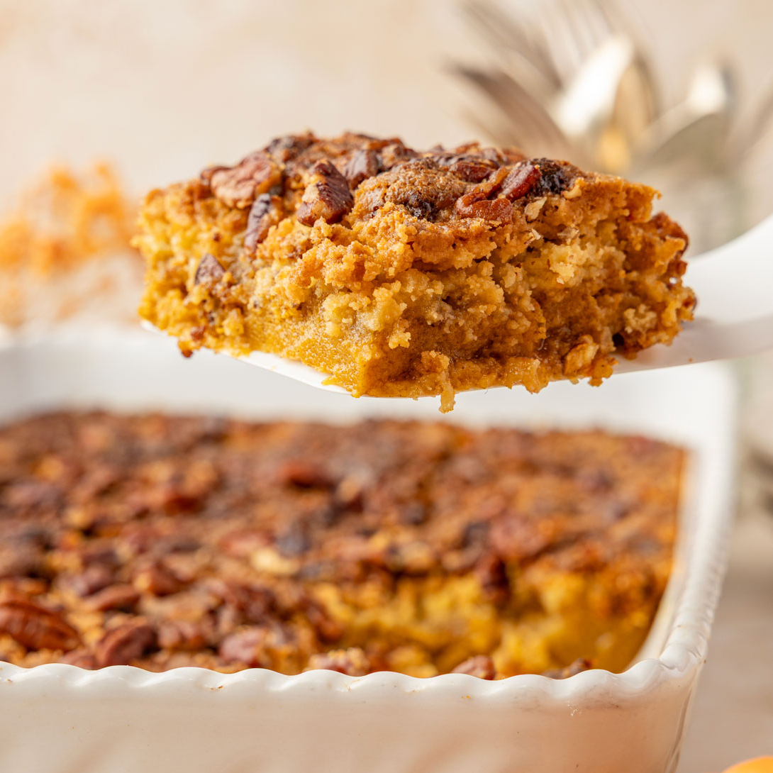 Pumpkin Crunch Cake on a spatula being removed from the cake