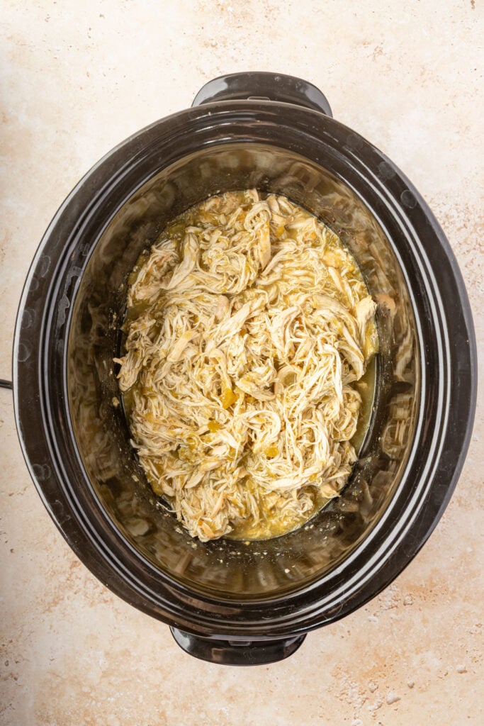 finished Slow Cooker Salsa Verde Chicken in a crockpot
