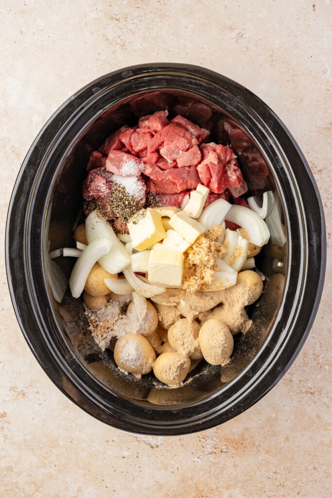 stew meat, potatoes, onions, butter, salt, pepper, onion soup mix, gravy mix.