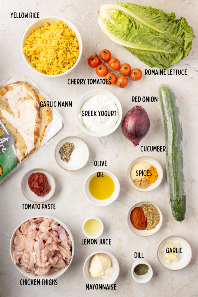All the ingredients for chicken swarm bowl on a marble surface with fresh ingredients around it.