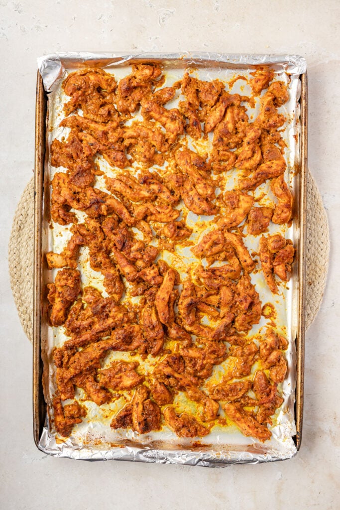 Cooked Shawarma chicken on a sheet pan