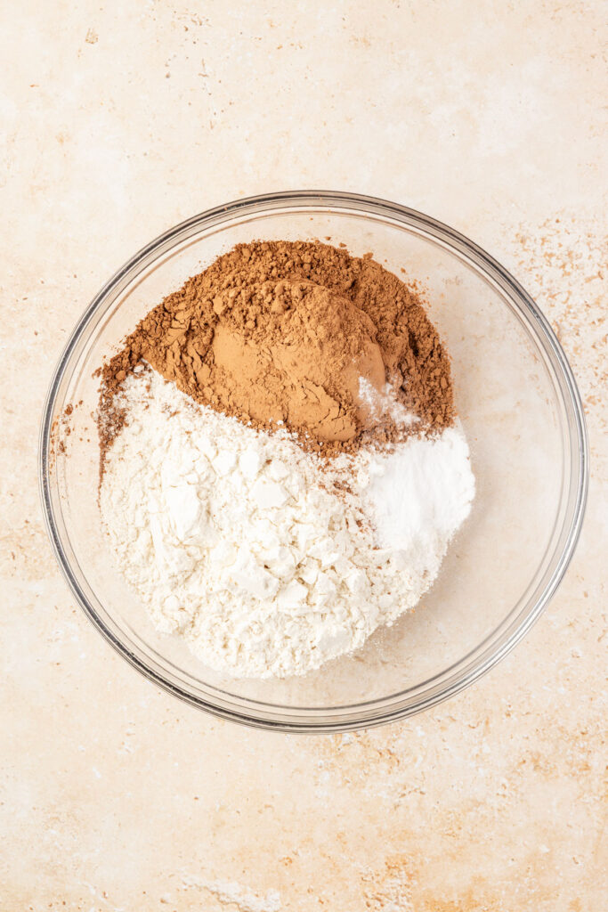 Flower, baking soda, salt, and cocoa powder in a mixing bowl.