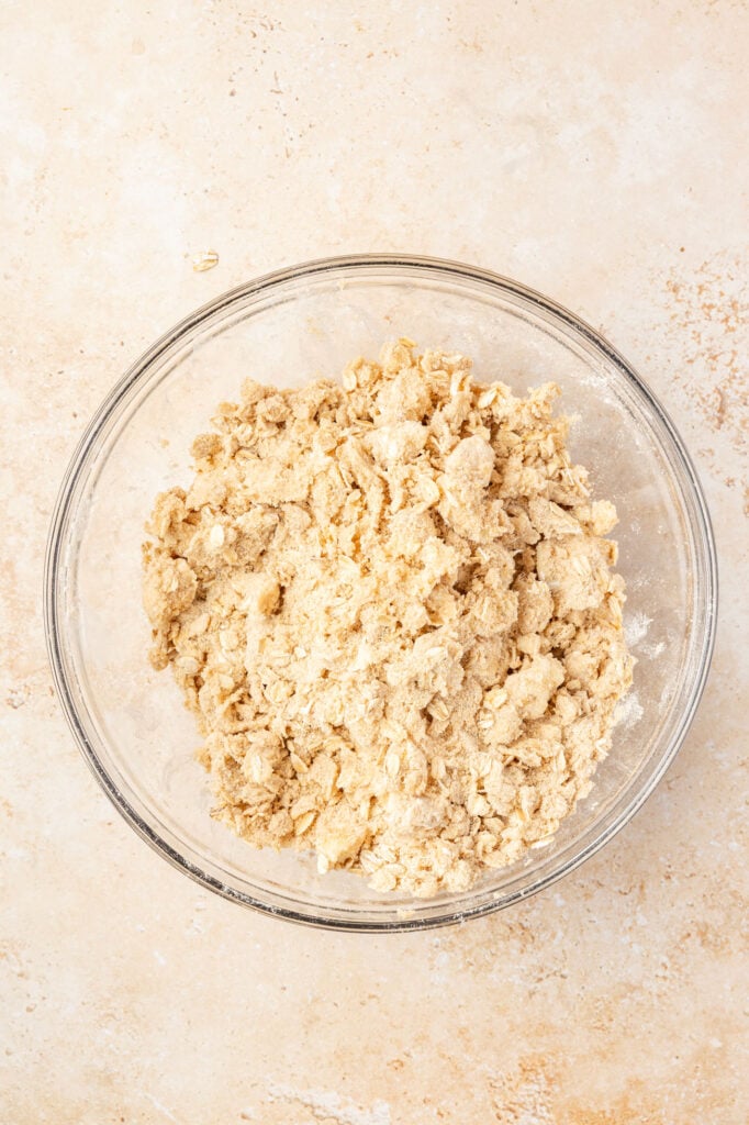 Crumb topping in a mixing bowl to show off the texture it should be.