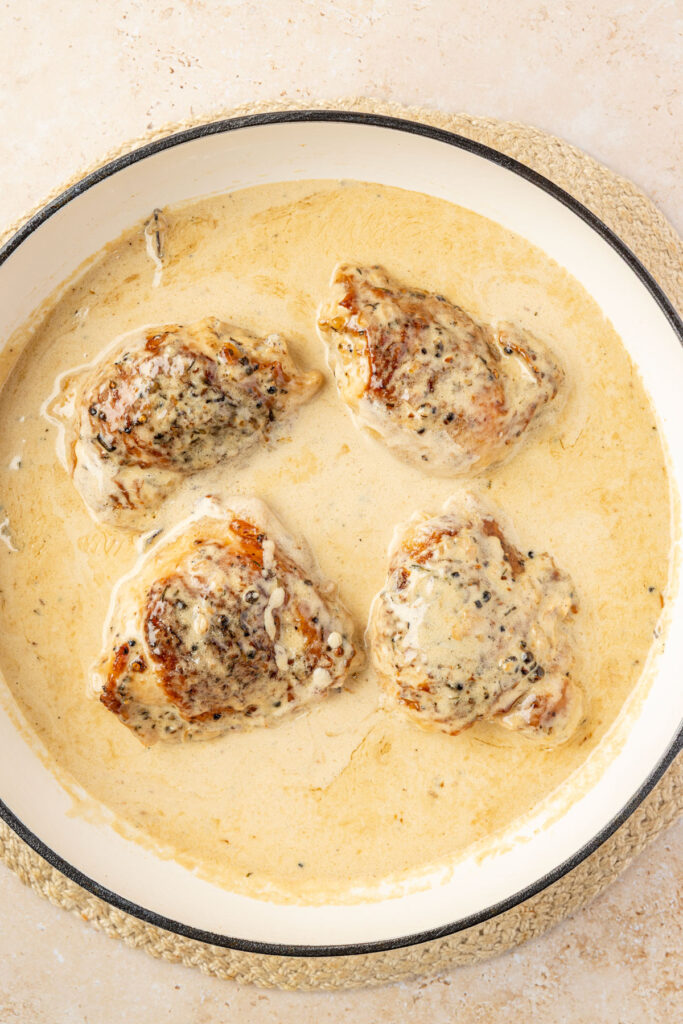 Finished Chicken Au Poivre in a pan.