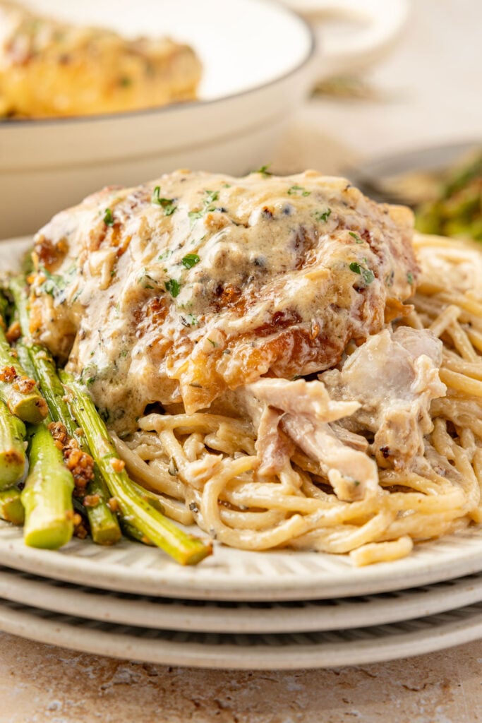 Chicken Au Poivre on pasta with asparagus.