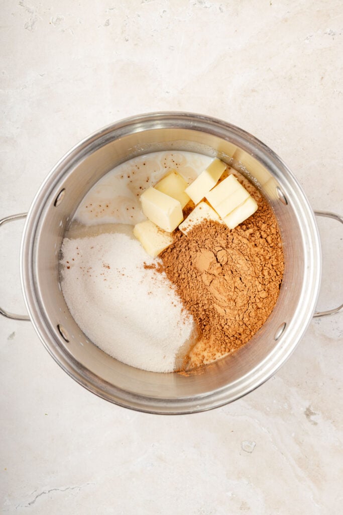 Pot filled with sugar, cocoa powder, butter, milk
