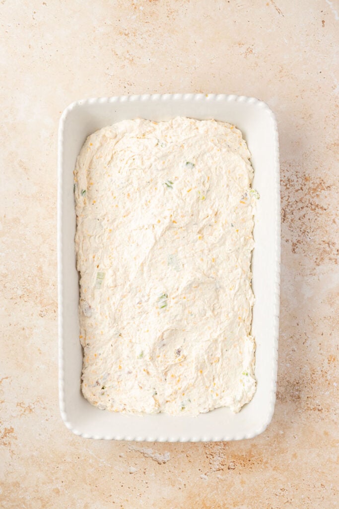 Cream cheese dip base in the 9 x 13 casserole pan.