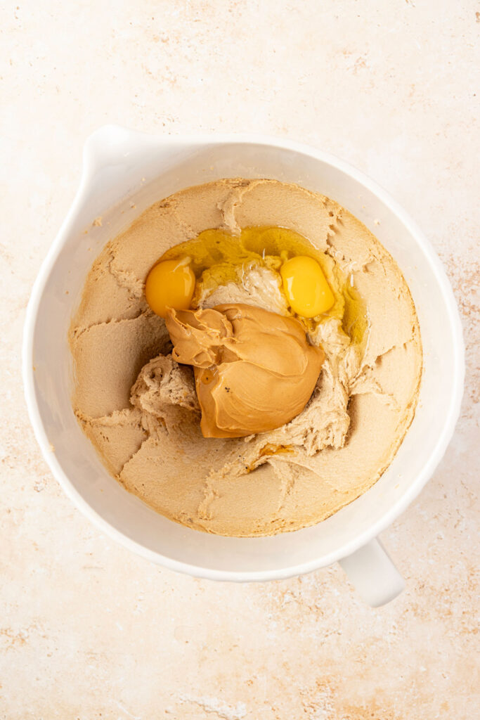 Creamed butter with eggs and peanut butter and vanilla. In a mixing bowl.