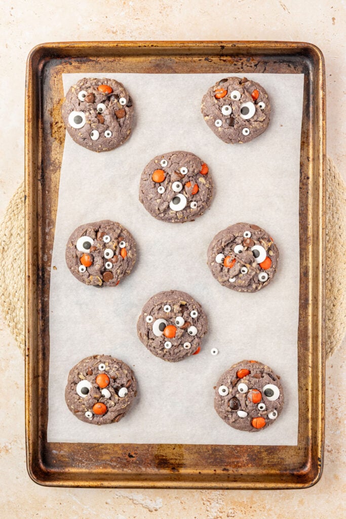 Finished Halloween Monster Cookies on a cookie sheet.