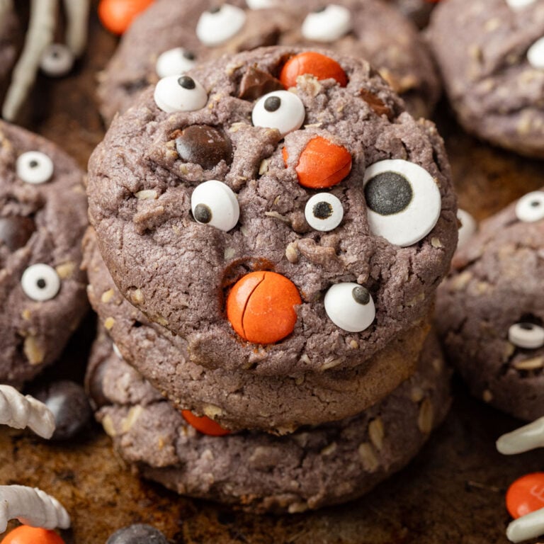 Halloween Monster Cookies on a medal background with skeleton hands, and Halloween M&M