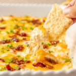 Crack chicken dip scoop up with a tortilla chip.